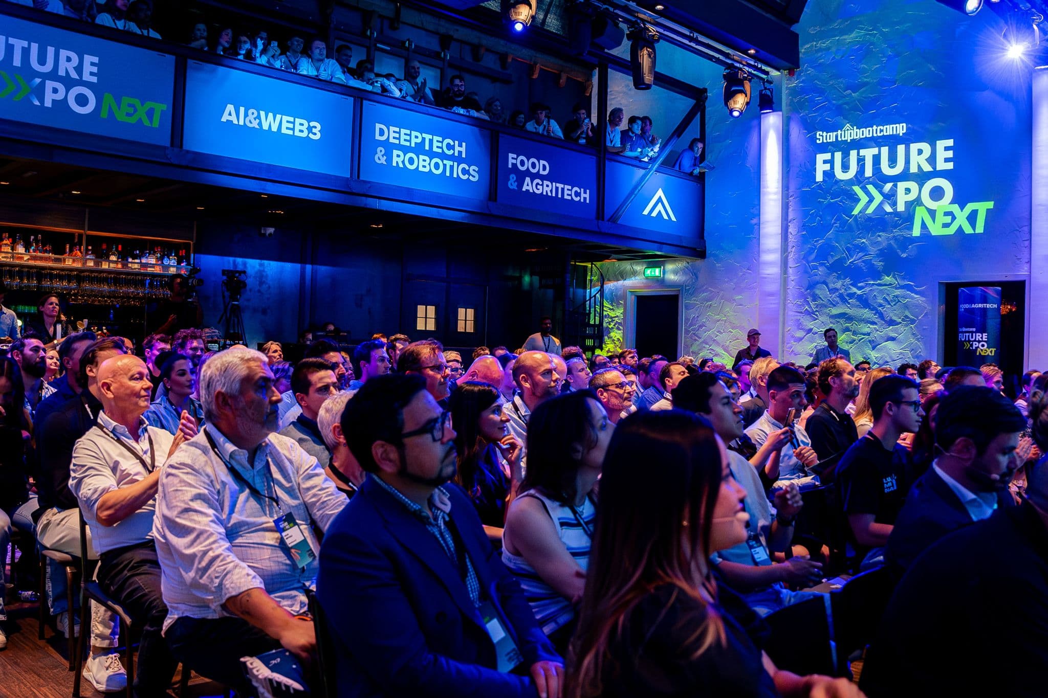 Investors and founders in conversation at an accelerator event